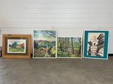 quatre photos encadrées représentant différents paysages accrochées au mur