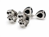 pair of black and silver skull cufflinks on a white background
