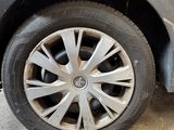 a close up of a tire on a car in a garage