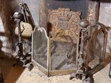 a fireplace with a fire place and a mirror on the mantle