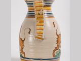 a vase that has a lion on it on a white background