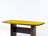 a wooden table with a yellow top on a white background