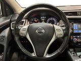 the interior of a car with a steering wheel and dashboard controls