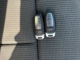 two cell phones that are sitting next to each other on the floor