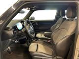 the interior of a car with the door open showing the driver ' s seat area