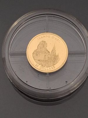 a gold coin with a picture of a woman on it