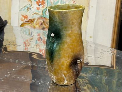 ACCOLAY, Vase en céramique émaillée à prises ajourée. Ebréch…