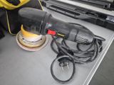 a picture of a sander and other tools sitting on a table