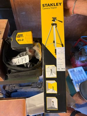 a box with a camera and a pair of shoes in it