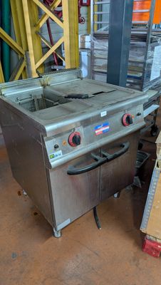 an image of a commercial fryer sitting in a warehouse