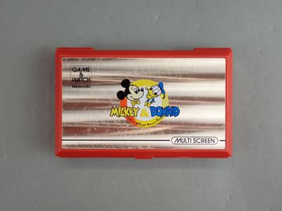 a red plastic case with a mickey mouse logo on it