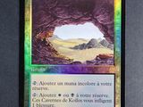 a close up of a card with a picture of a cave in the background
