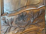 a wooden door with a carved design on it