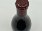 a bottle of wine that is sitting on a table