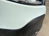 a close up of the front of a white car