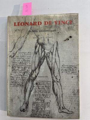 an old book with a drawing of a man ' s torso on it