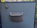 a door of a car that is open and has a handle on it