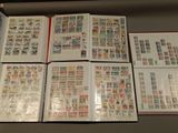 many different types of stamps on the pages of a book