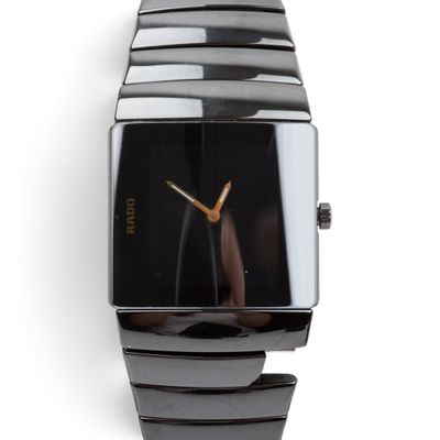 an image of a close up of a wrist watch on a white surface