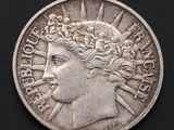 a close up of a coin with a woman ' s face on it