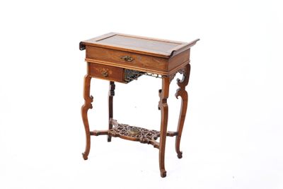 a small wooden table with a drawer on top of it
