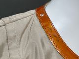 a close up of a mannequin torso with a leather collar