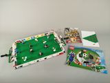 a bag of legos sitting on a table next to a bag of legos