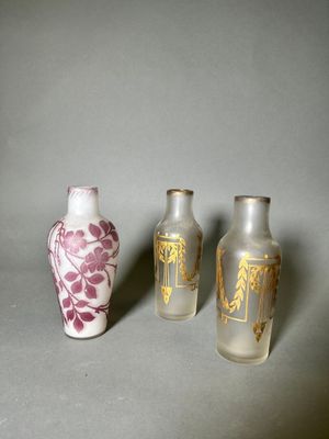 three vases sitting next to each other on a table