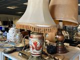 two lamps that are on a table in a room