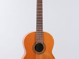 a close up of an acoustic guitar on a white background