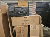 a pile of boxes and boxes sitting in a warehouse