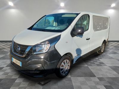 the white van is parked on a checkered floor in a room
