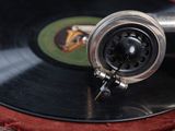 a black record on top of a red case