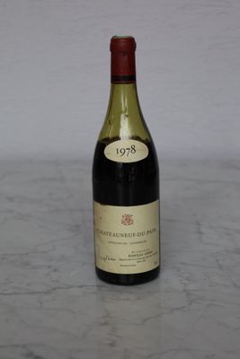 a bottle of wine that is sitting on a table