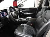 the interior of a car with black leather seats and a steering wheel