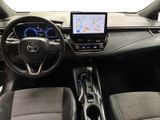 the interior of a car with a steering wheel, dashboard, and navigation system