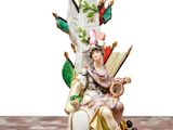 a figurine of a woman sitting on top of a table
