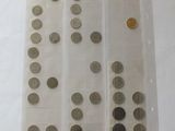 a lot of coins in a plastic bag on the table
