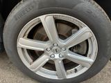 a close up of a tire on a car ' s rim