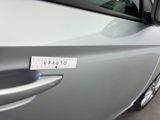 a close up of a car door handle with a sticker on it