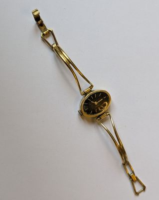 MARCEAU. Montre-bracelet de dame en métal plaquée or, à boît…