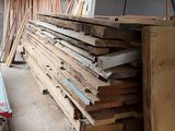 several pieces of wood are stacked on top of each other in a room