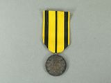 a close up of a medal on a gray surface