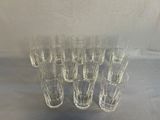 a lot of glasses that are sitting on a table