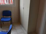 two blue chairs in the corner of a room