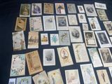many old postcards on a table with a black background