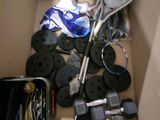 a box full of assorted tennis rackets and other items
