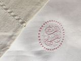 a close up of a piece of cloth with a monogram on it