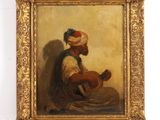 un tableau représentant un homme coiffé d'un turban, assis par terre