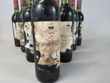 several bottles of wine are lined up in a row